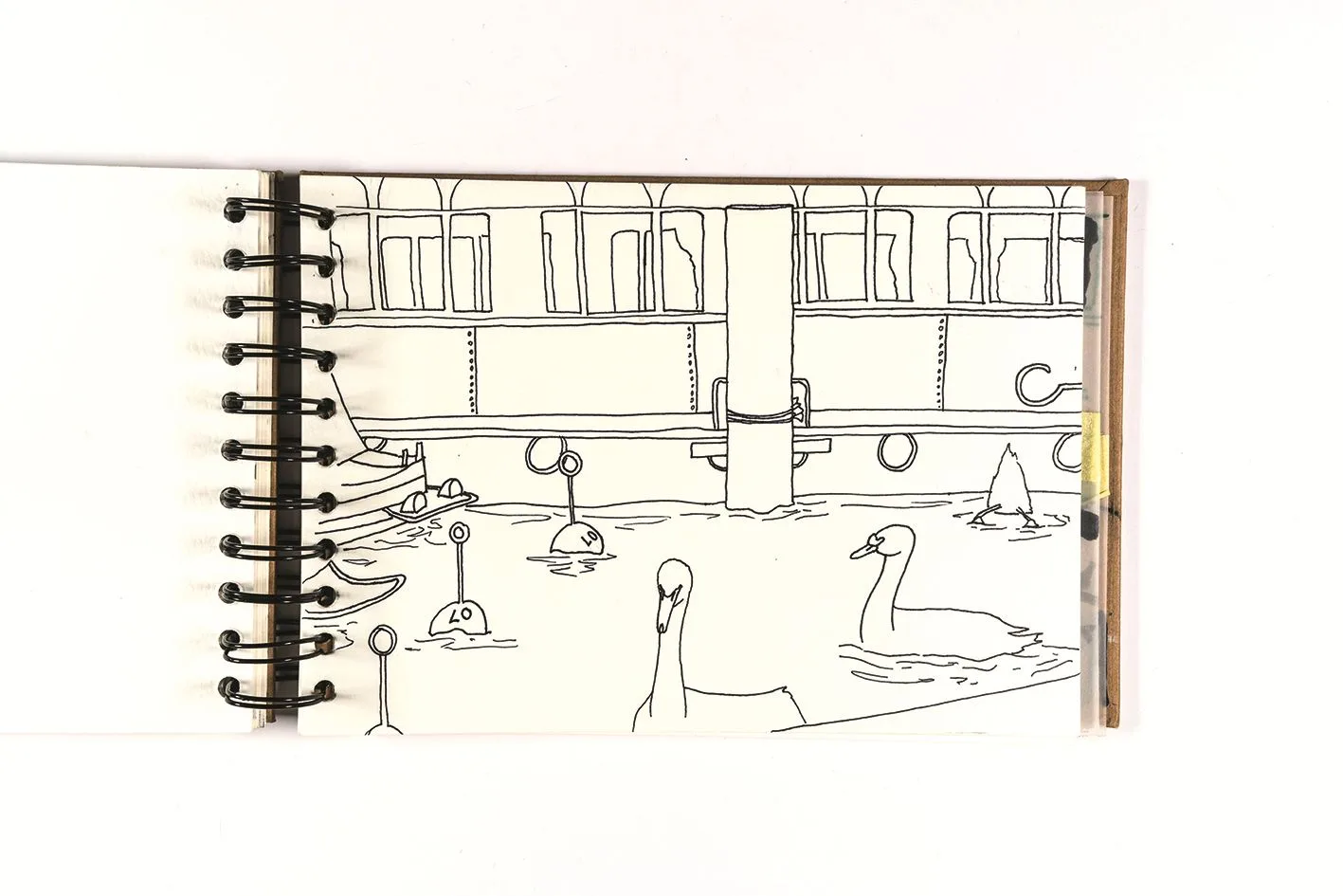 Ringbuch mit Linienzeichnung von Schwänen auf einem See